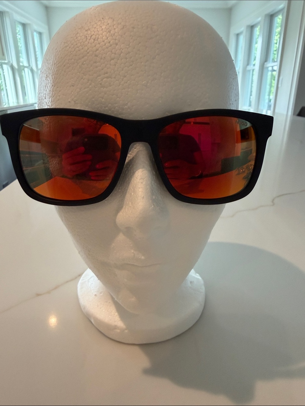 HUGO Men’s Black Sunglasses (recycled nylon) with Red-Orange Mirrored Lenses.